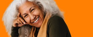 Smiling lady leaning on her hand 