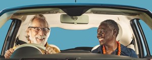 Male and Female couple sitting in a blue car
