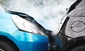 Blue car with damaged bonnet crashed into back of black car 