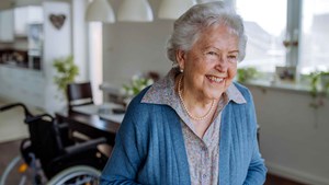 portrait-of-smiling-senior-woman-in-her-home-16-9