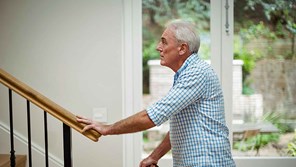 man-walking-up-stairs-16-9-compressed