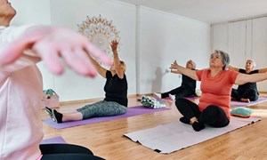 a-group-of-senior-women-engage-in-various-yoga-5-3