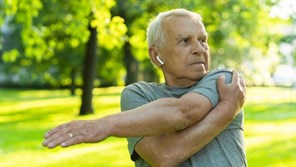 elderly-man-exercising-in-green-city-park-16-9