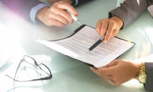 House purchase contract being reviewed before signing